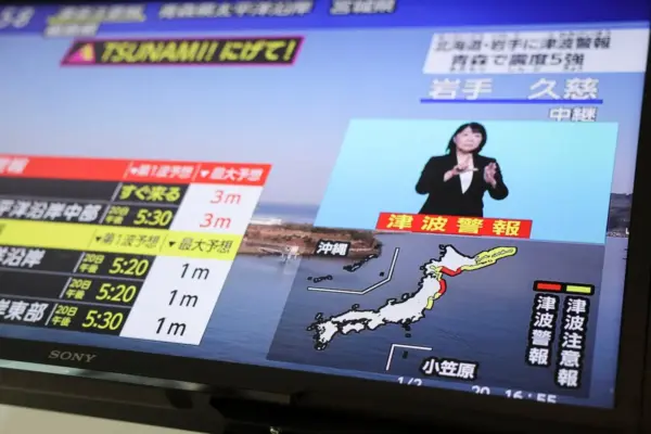 A magnitude 7.5 earthquake shakes northeast Japan and generates a tsunami