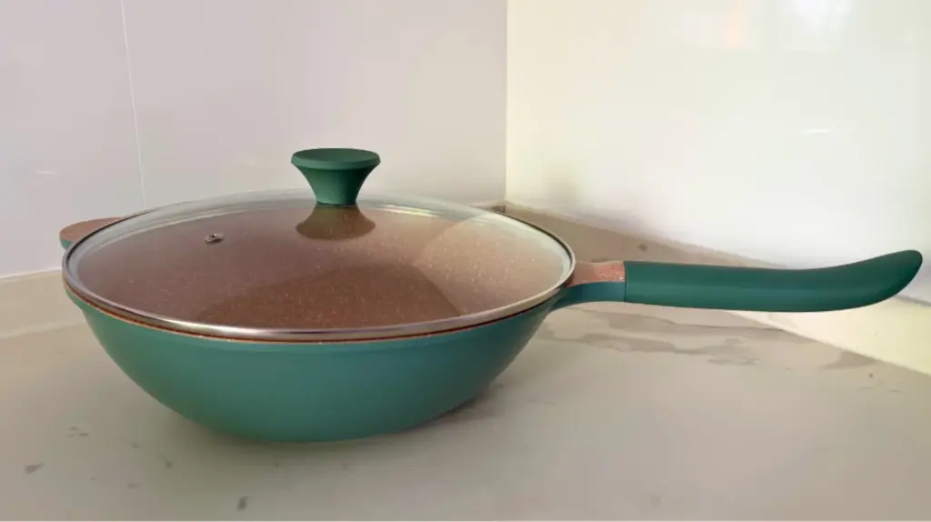 The Create Wok Studio pan is made of cast aluminum with a ceramic coating.