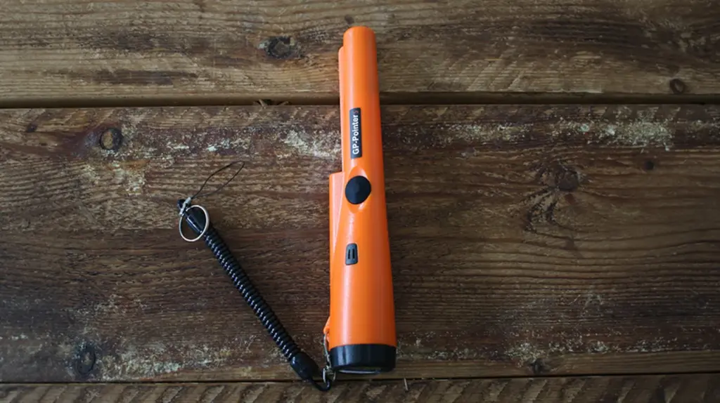 Metal detector on a wooden table.