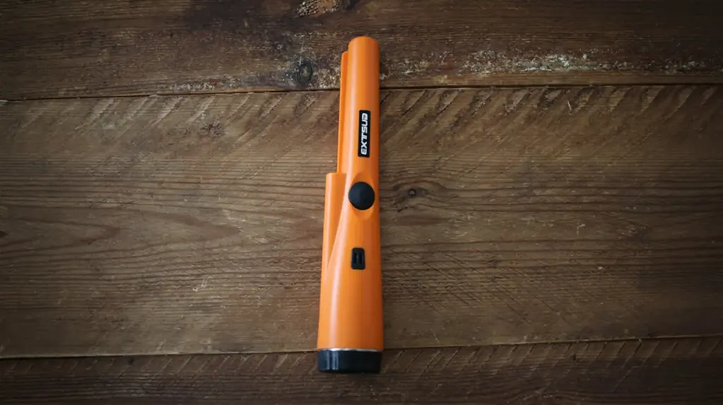 Metal detector on a wooden table.