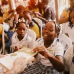 The effort to break down barriers of poverty and war to bring children to school