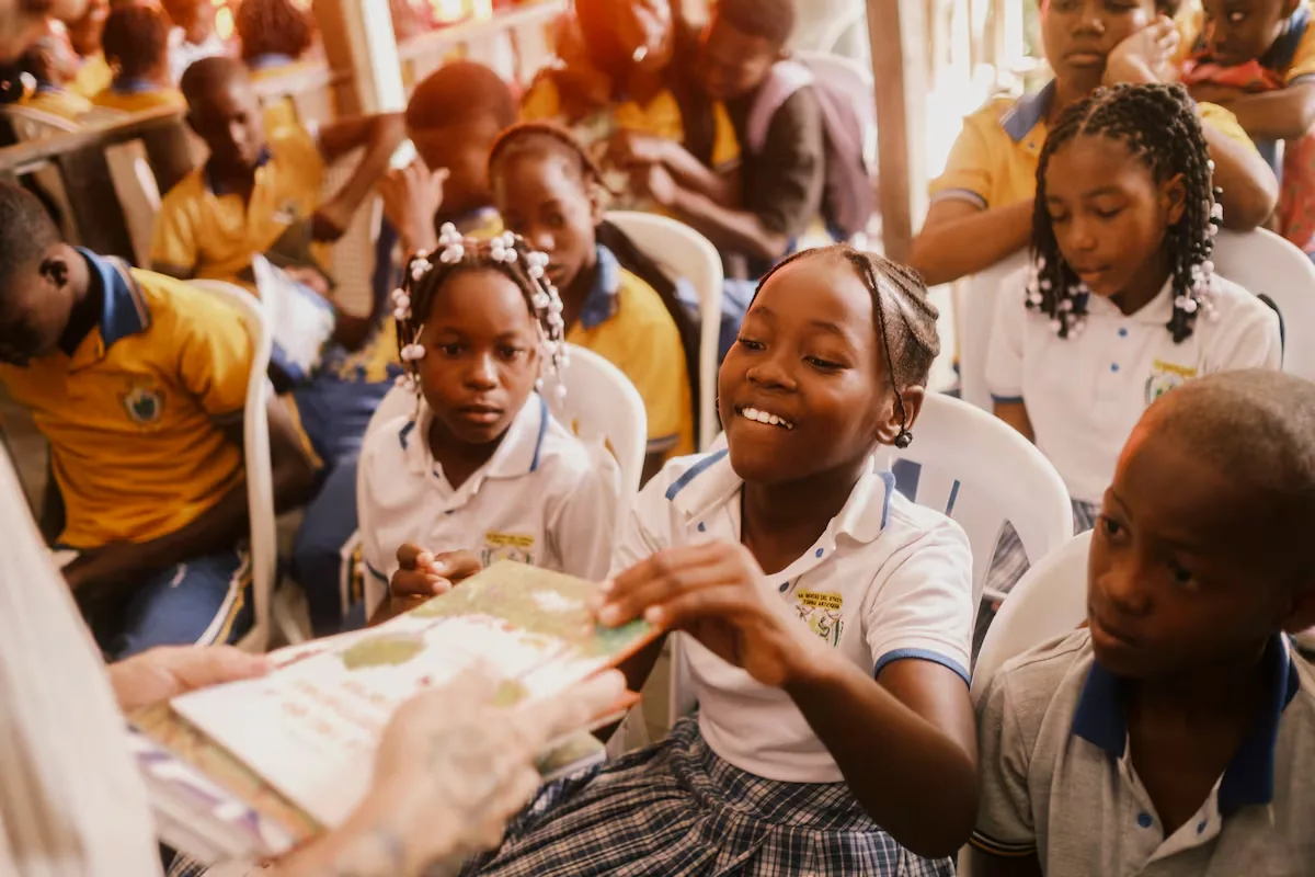 The effort to break down barriers of poverty and war to bring children to school