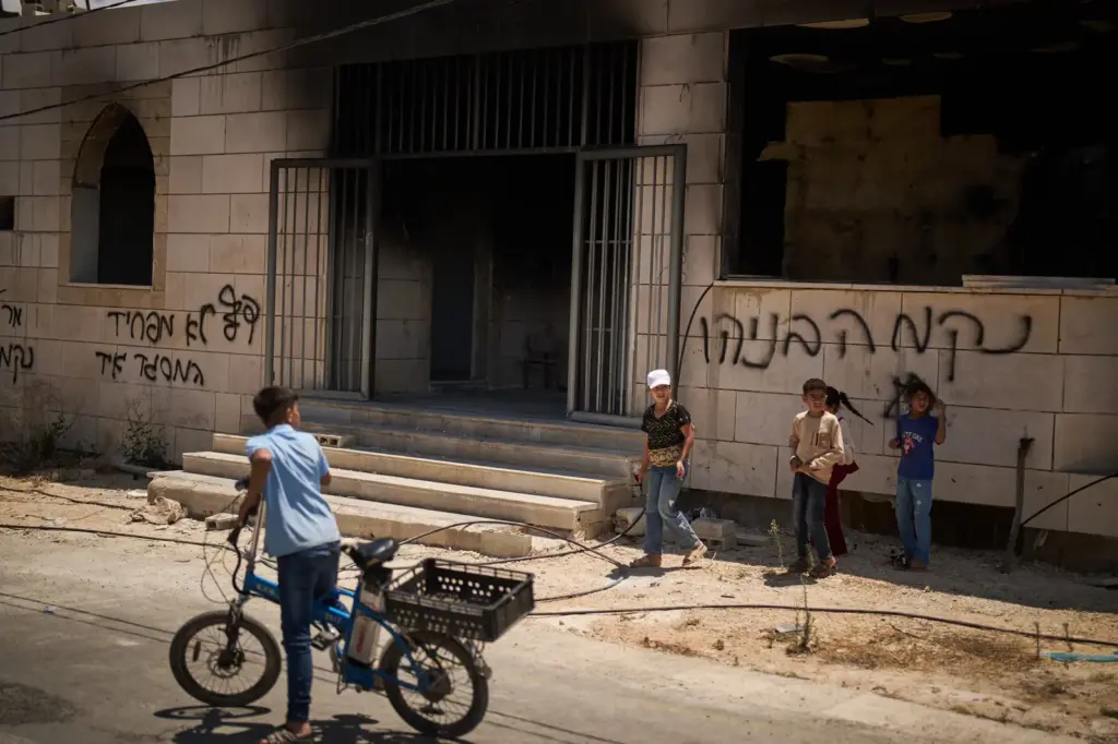 Israeli settlers set fire to two mosques, cars and fields in the West Bank