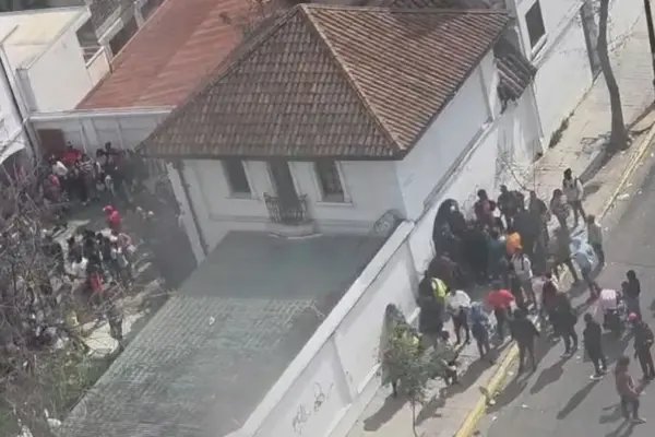 Hundreds of Haitians protest at the Haitian embassy in Chile over issues with immigration procedures