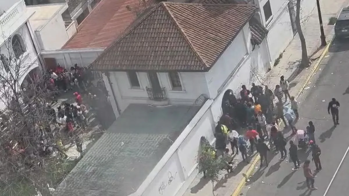 Hundreds of Haitians protest at the Haitian embassy in Chile over issues with immigration procedures