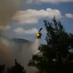 Two pilots die as two helicopters fighting a fire in Greece collide