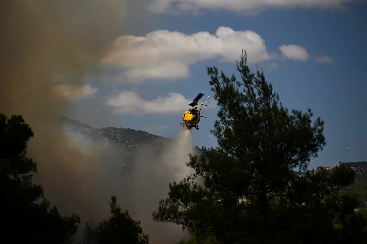 Two pilots die as two helicopters fighting a fire in Greece collide