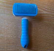 Self-cleaning hair removal brush