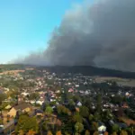 Forest fires in Europe force thousands to evacuate and cause dozens of injuries