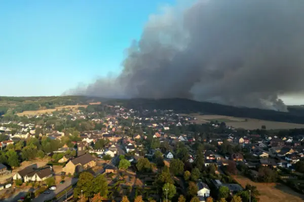 Forest fires in Europe force thousands to evacuate and cause dozens of injuries