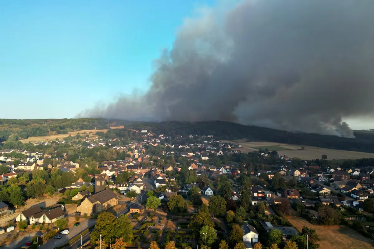 Forest fires in Europe force thousands to evacuate and cause dozens of injuries