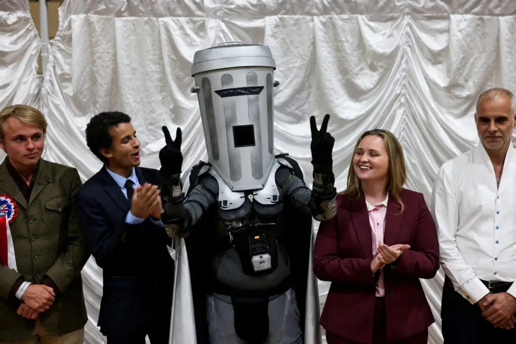 The ultra-British Farage retains his seat in Parliament after defeating the motley Count Trash Cube
