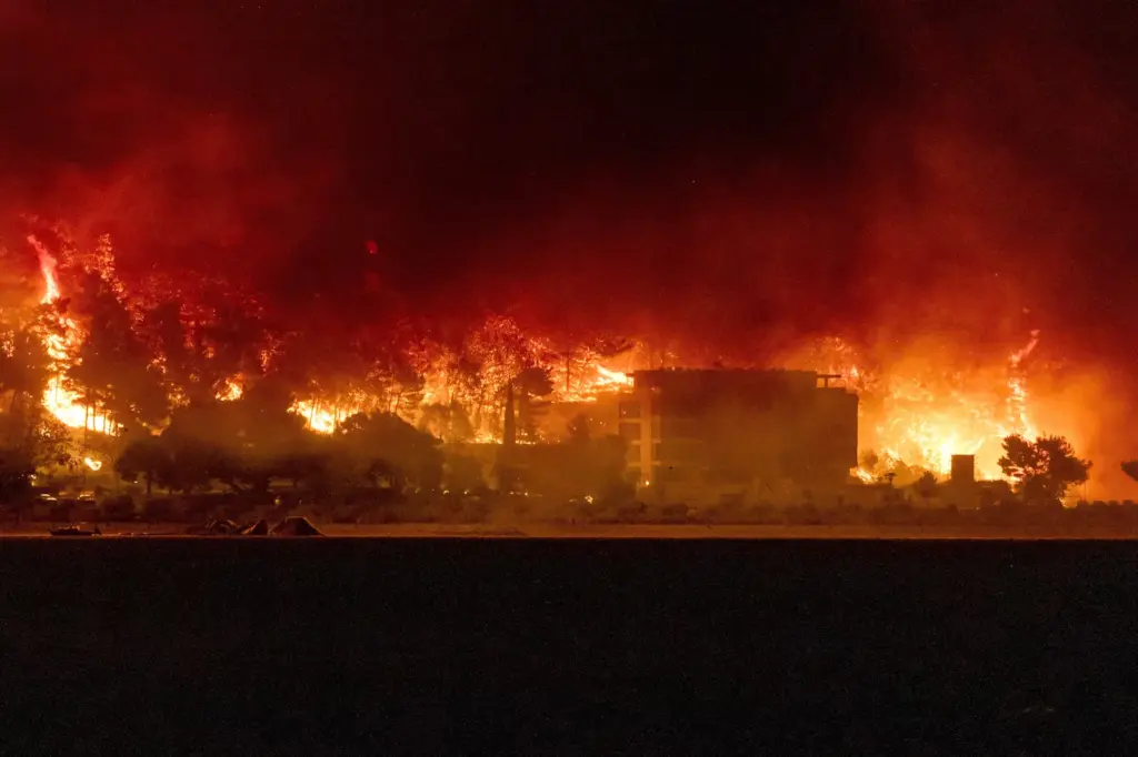 Forest fires in Europe force thousands to evacuate and cause dozens of injuries