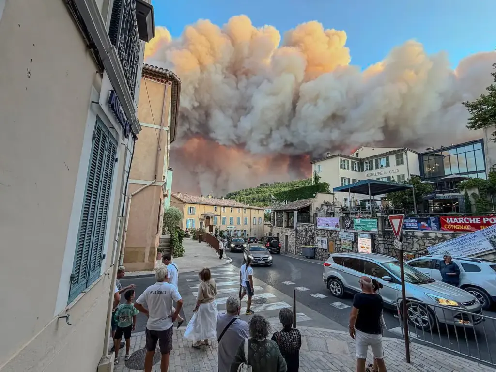 Forest fires in Europe force thousands to evacuate and cause dozens of injuries