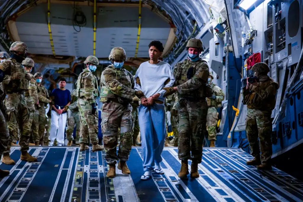 US military personnel escort alleged members of the Tren de Aragua gang to the Terrorism Detention Center in El Salvador, March 2025.