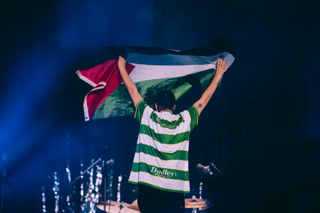 The vocalist of the Irish band Fontaines D.C., Grian Chatten, performs at the Reading Festival wearing the Cwmbran Celtic away jersey. Image courtesy of Patrick Gunning.