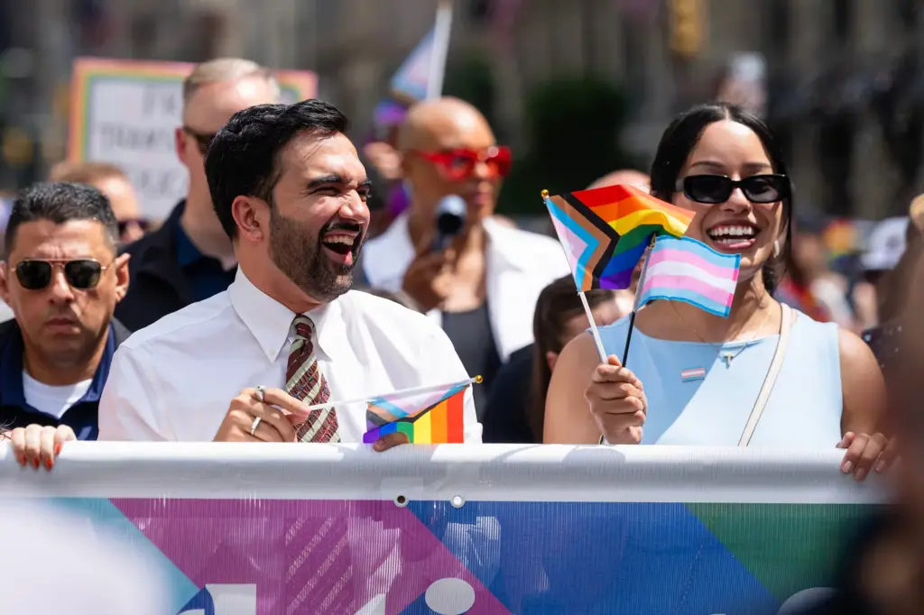 New York Mayor Zohran Mamdani with the LGTBIQ+ and trans flags at this year’s city Pride march on June 28.