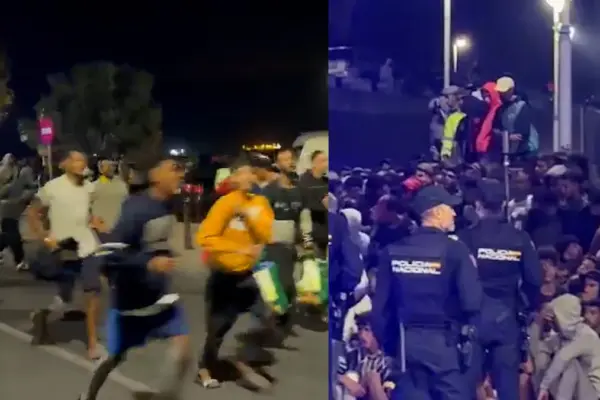 Avalancha inicial y momentos de tensión en el traslado de migrantes al campamento del puerto de Ceuta