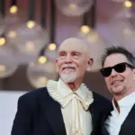 John Malkovich and Sam Rockwell excite in Venice with the melancholic tragicomedy of the spy-clowns of ‘Wild Horse Nine’