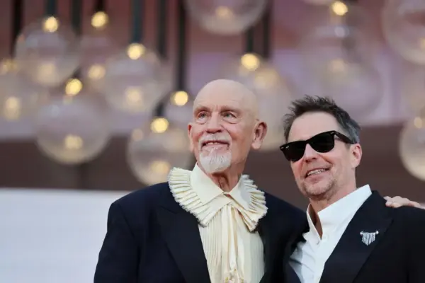 John Malkovich and Sam Rockwell excite in Venice with the melancholic tragicomedy of the spy-clowns of ‘Wild Horse Nine’