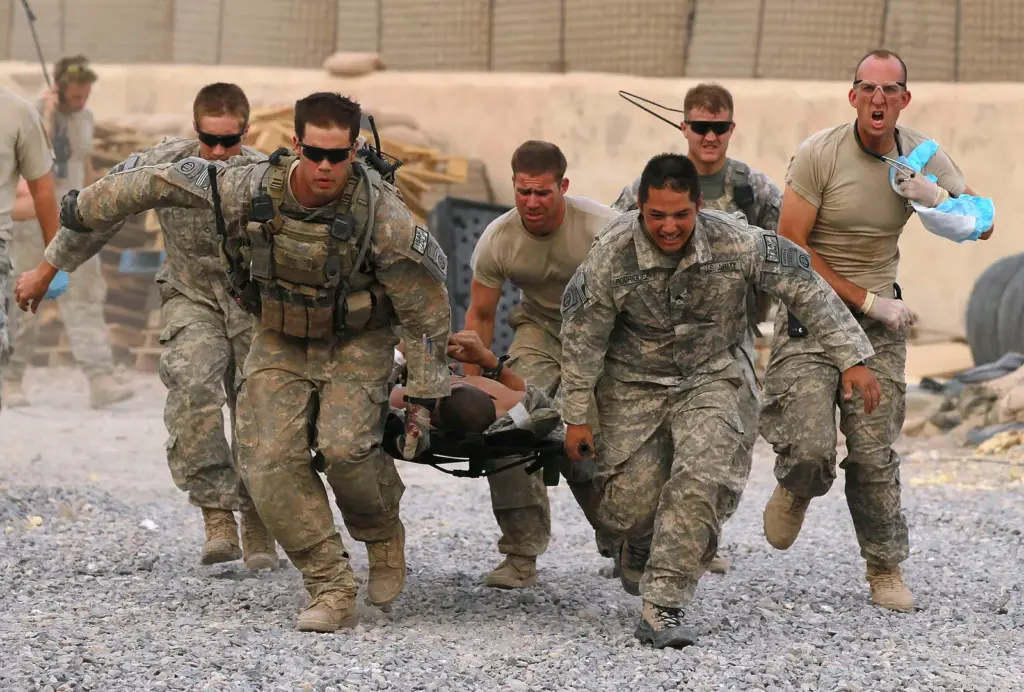 U.S. soldiers evacuate a wounded comrade near Kandahar (Afghanistan), June 24, 2010.