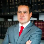 Chilean former prosecutor Vinko Fodich and three police officers arrested in an investigation for extortion kidnappings